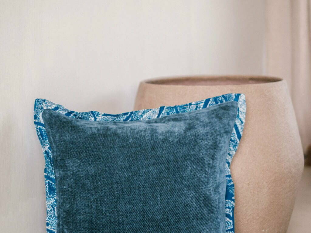 cushion cover in velvet with a batik trim